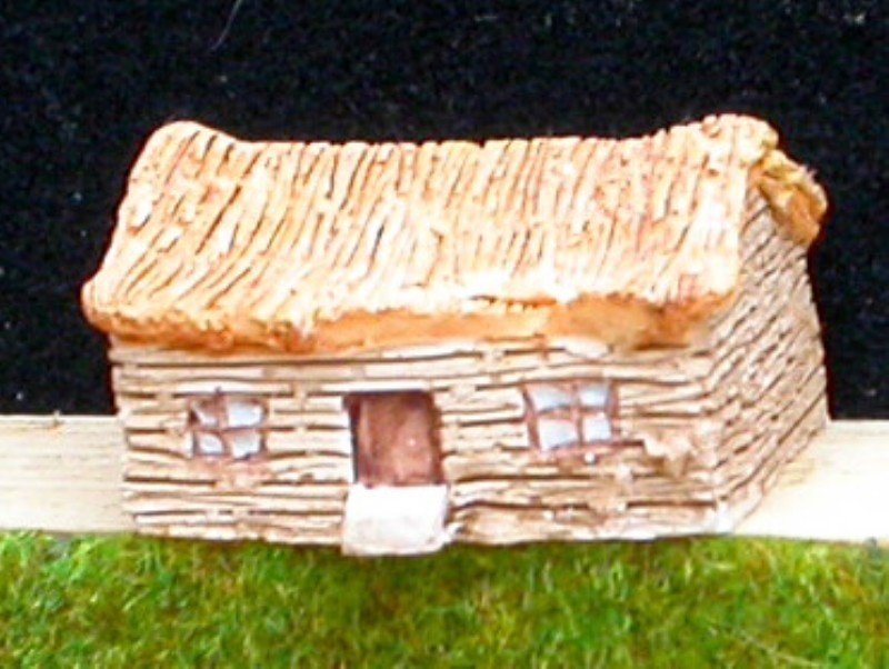 A4 Maison en bois et toit de chaume