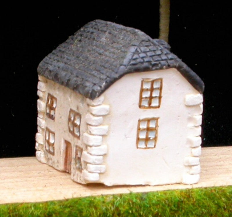 V7 Maison avec toit à pans coupés